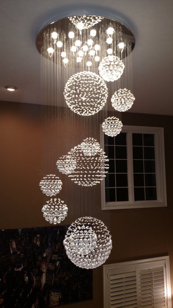 Cascading crystal chandelier in a two-story entry