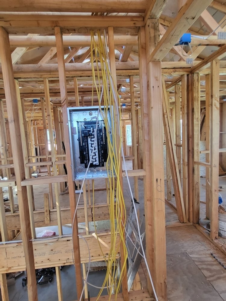 New construction rough-in: panel set and circuits run before drywall