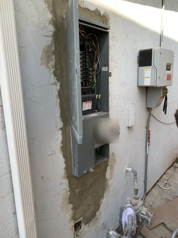 Older panel with corrosion, opened for inspection