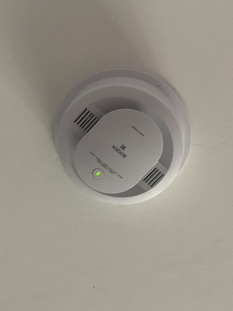 Smoke alarm installed on a ceiling