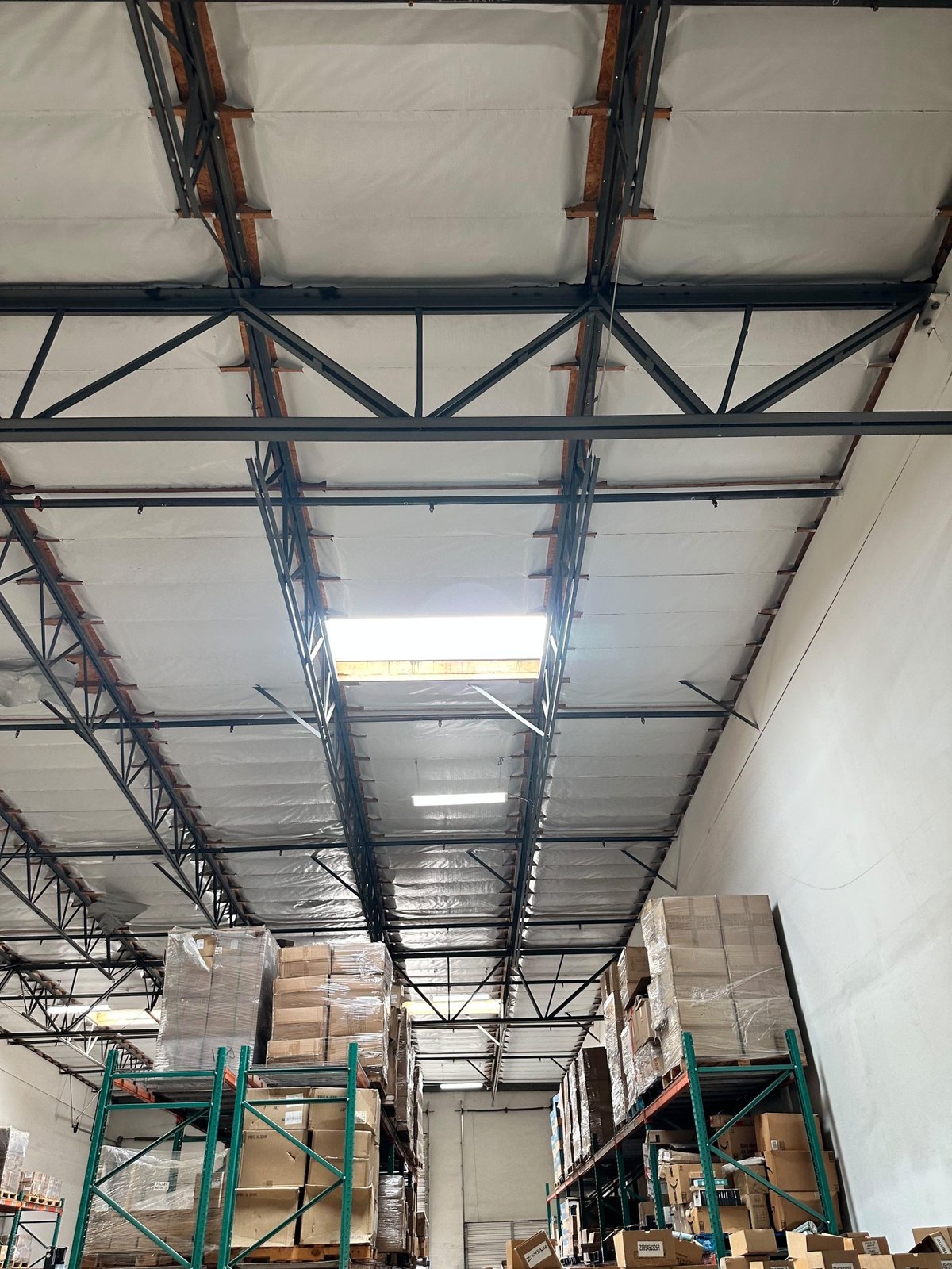 Warehouse LED lighting over the racking aisles